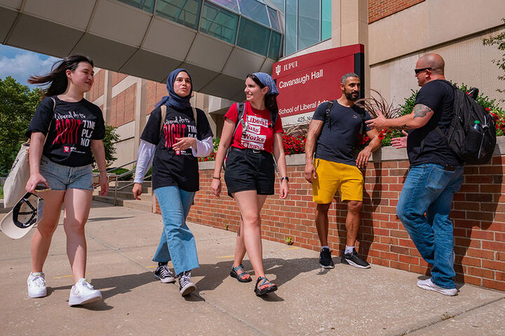 School of Liberal Arts students walk outside Cavanaugh Hall at IUPUI